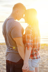 Fototapeta premium couple happy on the beach sunset romantic kiss close-up