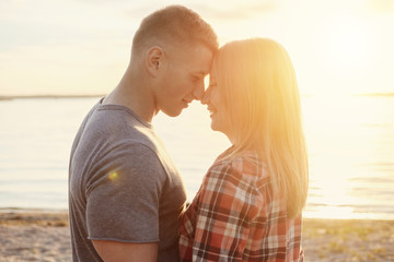 Fototapeta premium couple happy on the beach sunset romantic kiss close-up