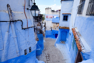 Fototapeta na wymiar Street landscape of the of old historical medieval city Сhefchaouen in Morocco. Blue town village narrow streets of medina