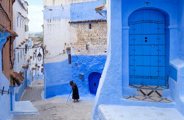 Fototapeta na wymiar Street landscape of the of old historical medieval city Сhefchaouen in Morocco. Blue town village narrow streets of medina