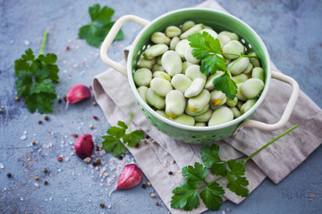 strainer full of fresh broad beans