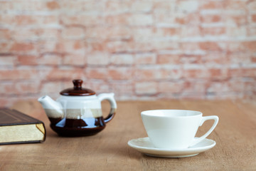 white coffee cup for refreshment on wood table.