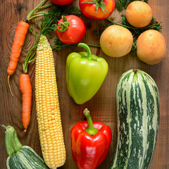 Vegetables laid out on a wooden table.