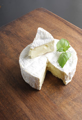 Camembert brie cheese on a wooden background