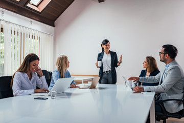 Business people conference in modern meeting room.