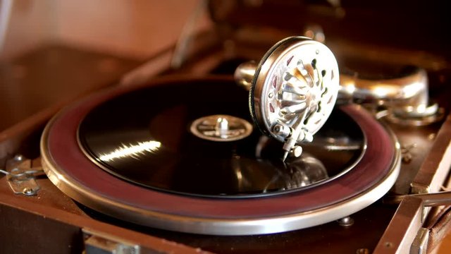 Retro gramophone with vinyl sounds jazz and blues music in the room