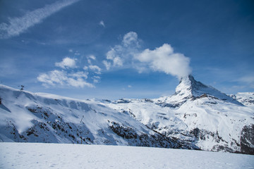 Fototapeta na wymiar The famous mountain Matterhorn peak with cloudy and blue sky from Gornergrat, Zermatt, Switzerland