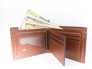 100, 50 , 10 US. dollar banknote in the brown wallet on white background