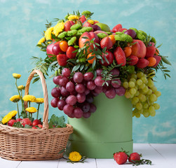 a beautiful bouquet of fruits and flowers for the birthday of strawberries grape peaches