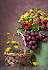 a beautiful bouquet of fruits and flowers for the birthday of strawberries grape peaches