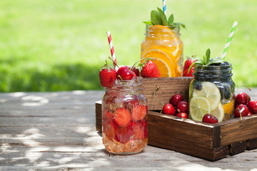 Fresh lemonade jar with summer fruits and berries