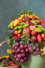 a beautiful bouquet of fruits and flowers for the birthday of strawberries grape peaches