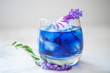 Butterfly pea juice with ice in transparent glass
