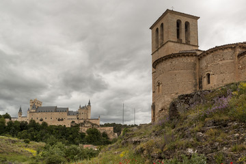 Fototapeta premium Alcazar de Segovia next to the Templar church of Vera Cruz. Spring scene Castilla y Leon, Spain. Europe 
