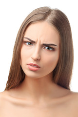 Fototapeta premium Indignant young woman looks aggressively