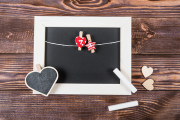 Hearts, love, Valentine's Day on a dark wooden rustic background