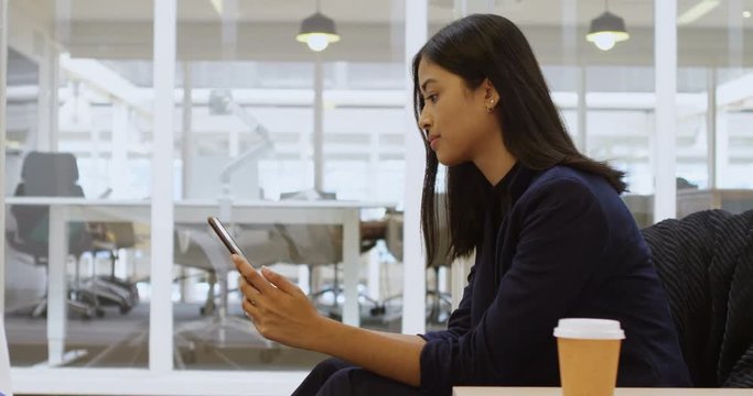 Businesswoman using digital tablet in office 4k