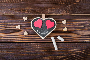 Hearts, love, Valentine's Day on a dark wooden rustic background