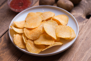 Crispy potato chips, potato and sauce 