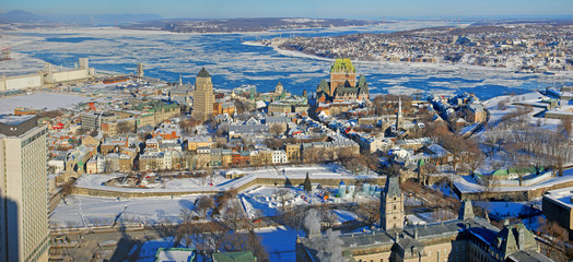 Fototapeta premium Quebec Lower City, St. Lawrence River in winter, Quebec, Canada. Historic District of Quebec City is UNESCO World Heritage Site since 1985.