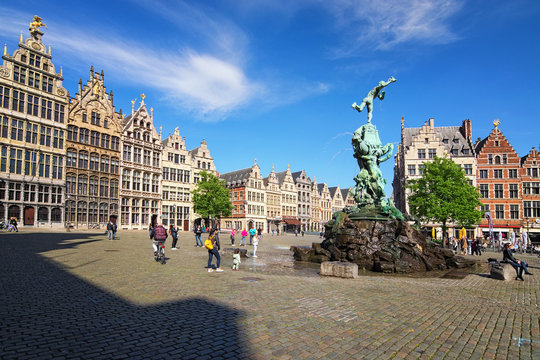 Antwerp, Belgium-MAY 02, 2018: Brabo fountain on Grote Markt (Market square) with traditional Flemish architecture. It is a main square in the city and one of the main attractions in the city