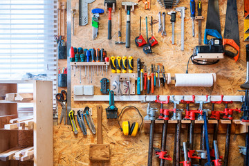 Workshop of wood with a large amount of instruments and tools.