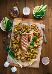Red sea perch or red grouper baked with potatoes, top view