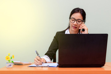 Happy young business woman work in modern office on computer