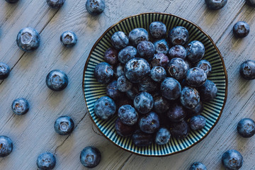 Blueberries Arranged on Blue Table