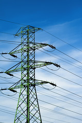 Power poles on the background of blue sky
