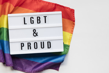 LGBT and proud lightbox message on an LGBT gay pride flag