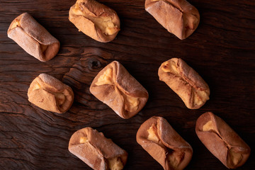 Cookies with Cottage cheese baked in oven, on wooden table and black background. Close up, selective focus. Concept of homemade food