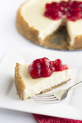Cherry Cheesecake with fork, vertical