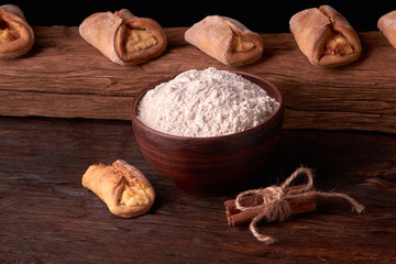 Close up Flour bread and whole grain , rolling pin and Cottage cheese cookies. Concept of homemade food