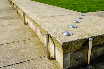 Anti-skateboarding devices installed on a low stone wall