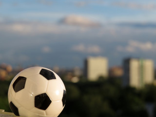 Soccer ball on background of summer city. Soccer arena, concept for football championship in Russia