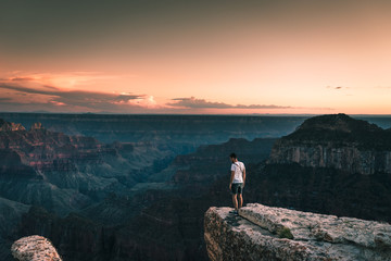 young man with Magnificent view of Grand Canyon, Arizona, USA.