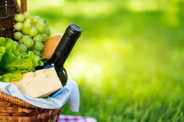 Picnic basket in summer park © photopixel