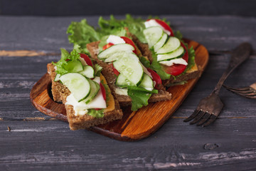 three sandwich of dark bread