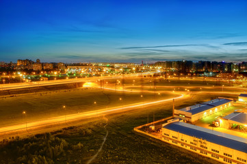 ring road in St. Petersburg at white night, new buildings and high-voltage power lines