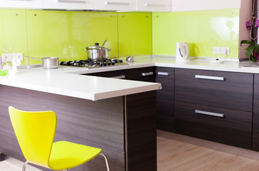 nice kitchen with great  table worktop and yellow chair