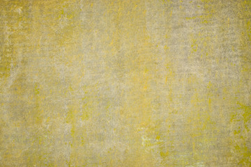 Yellow wall with irregularities in the finish. Background structure.