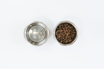 Dry dog food in metal bowl, top view and flat lay