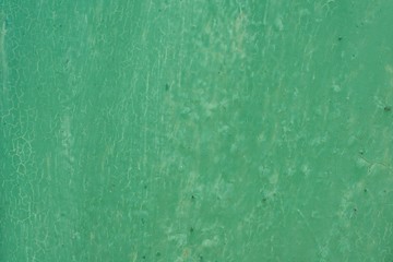 Texture background green painted cracked iron surface.