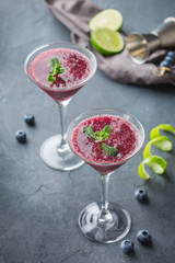 Alcohol frozen blueberry cocktail margarita with tequila and lime