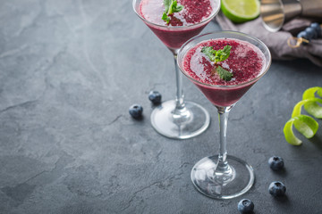 Alcohol frozen blueberry cocktail margarita with tequila and lime