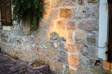 shadow of a kissing couple in love on an old stone wall
