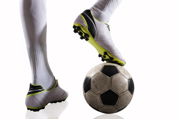 Soccer player with soccerball ready to play. Isolated on white background