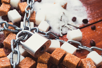 Fototapeta na wymiar Sugar and chain with a lock
