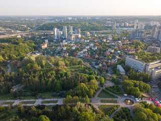 A bird's eye view, panoramic view from the drone to the view of the central alley of the Botanical Garden and the construction of the Pechersk district in the city of Kiev, Ukraine